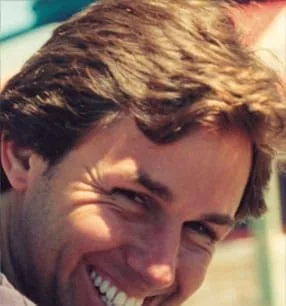 Guillermo as an adult with a big smile